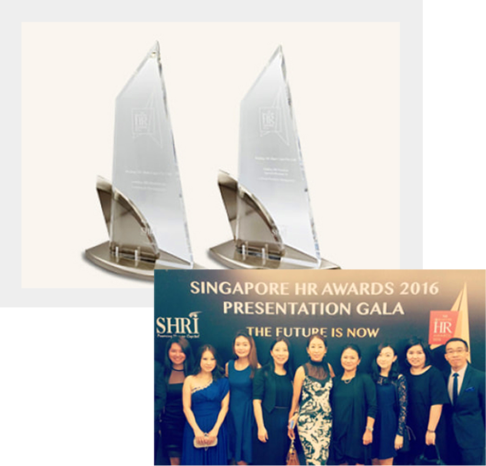 Two glass HR awards on stands, with a photo below showing nine people dressed formally at the Singapore HR Awards 2016 Presentation Gala.